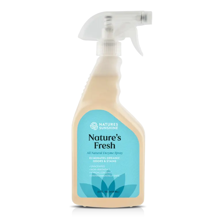 A white spray bottle with a label that includes the brand 'Nature's Fresh' and information about the product being an enzyme spray for eliminating odors and stains.